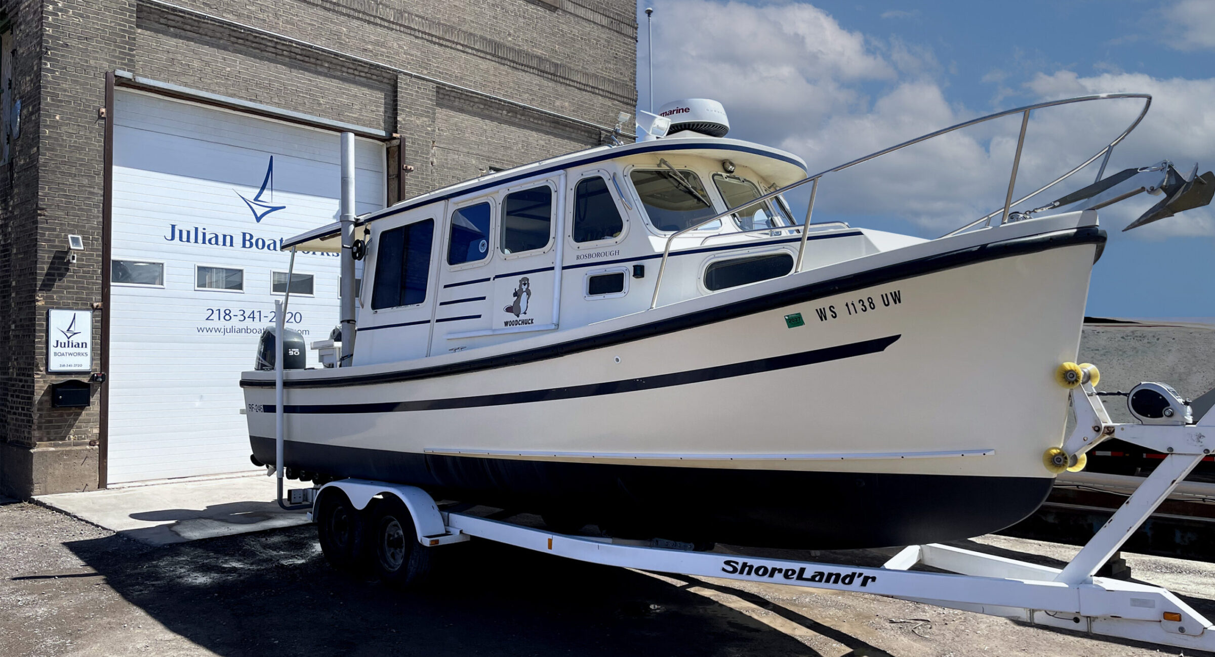 boat in front of Julian Boatworks